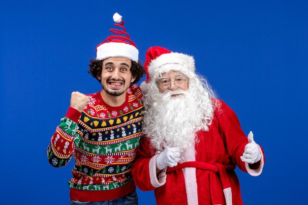 Front view santa claus with young male just standing