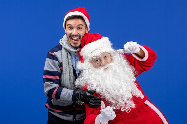 Free photo front view santa claus with young male