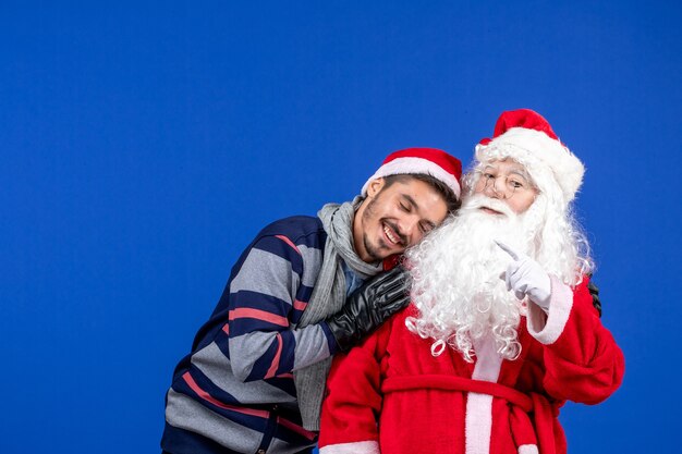 Front view santa claus with young male