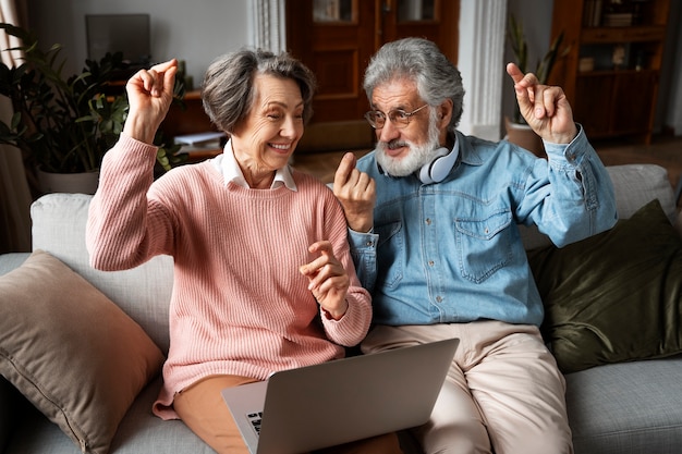 Free photo front view senior people dancing