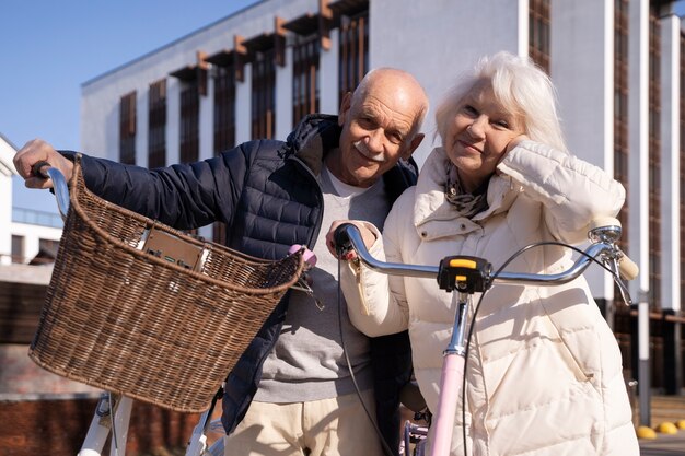 Front view senior people with bicycles