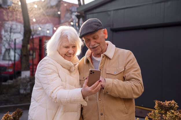 Front view senior people with smartphone