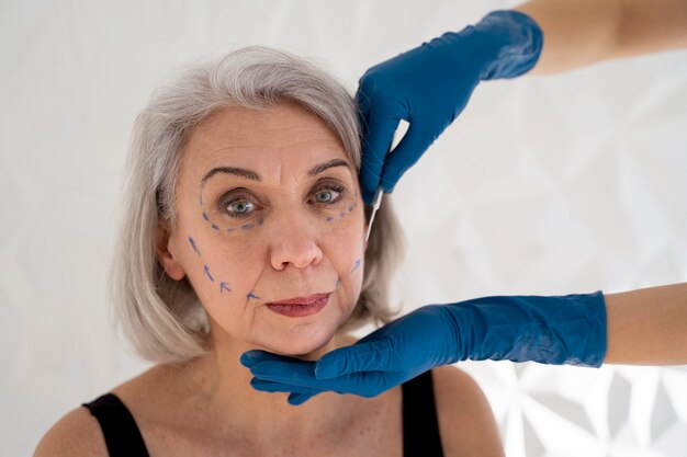 Front view senior woman with marker traces