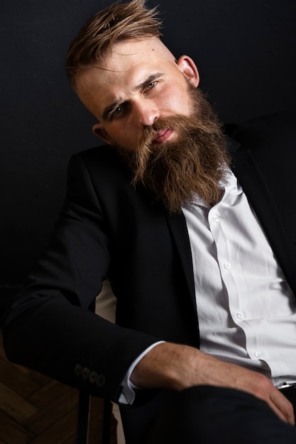 Free photo front view sensitive man posing in studio