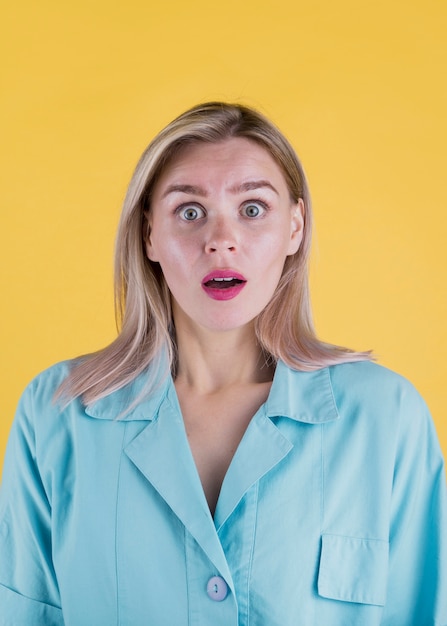 Front view of shocked blonde woman