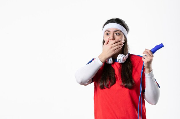 Front view shocked young female in sport clothes with skipping ropes