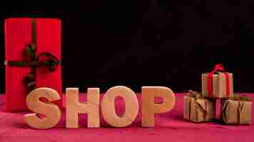 Free photo front view of shop word on red table