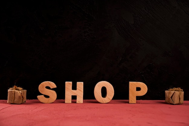 Front view of shop word on red table