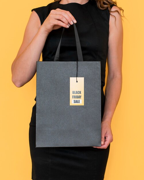 Free photo front view shopping bag with black friday label