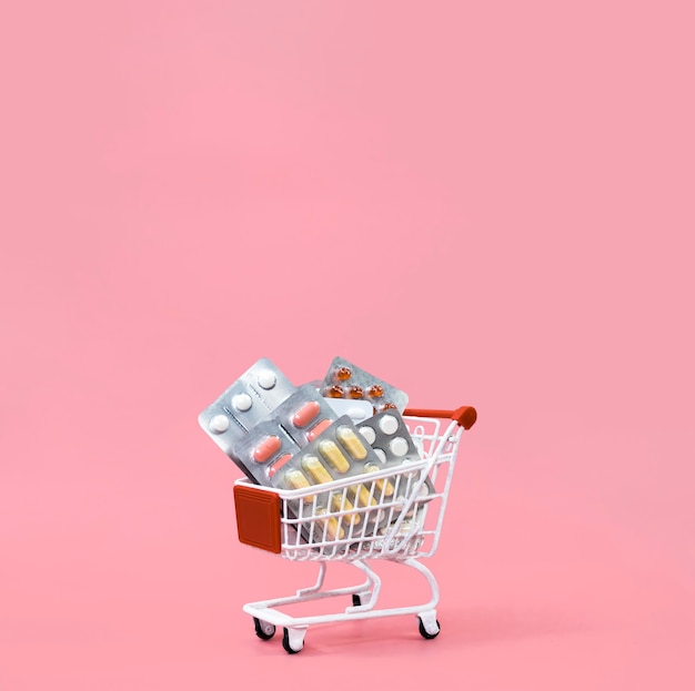 Front view of shopping cart with pill foils and copy space
