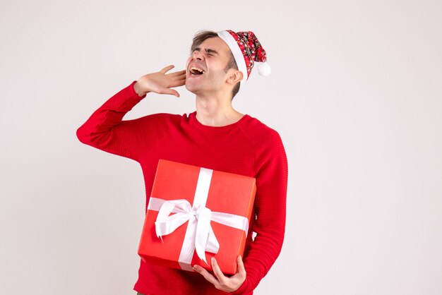 Front view shouted young man with santa hat shouting on white 