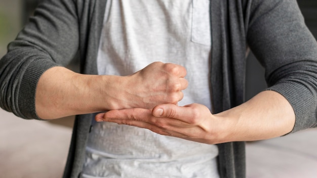 Free photo front view of sign language concept