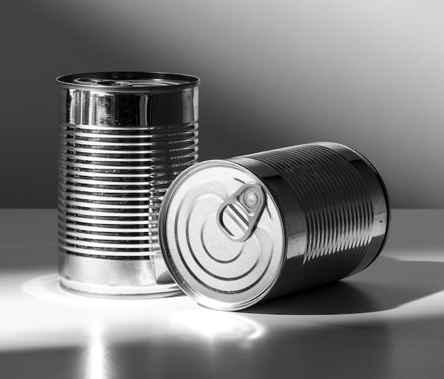 Front view silver tall round tin cans