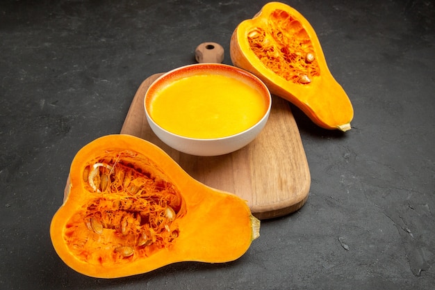 Front view simple pumpkin soup with fresh pumpkins on grey table smooth thanksgiving dine