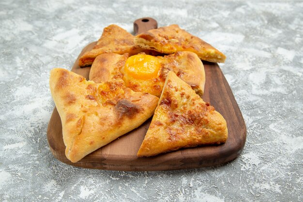 Front view sliced egg pastry baked bread on a white space