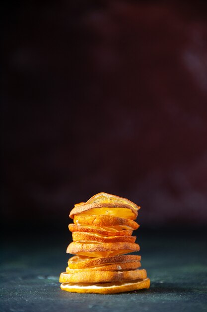 Front view sliced fruits tangerines and apples on dark background ripe mellow color fruit tree taste juice