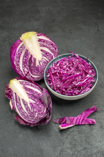 Front view sliced red cabbage fresh vegetable on a dark table