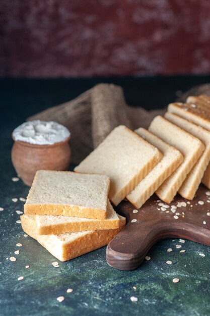 Front view sliced white bread on a dark background tea breakfast food pastry morning loaf bakery dough bun