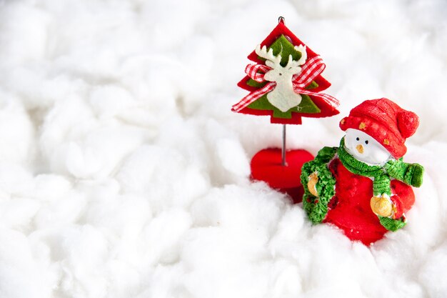 Front view small xmas toys on white background