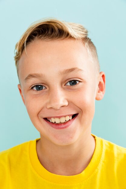 Front view smile boy wearing yellow t-shirt