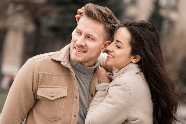 Front view of smiley couple outdoors