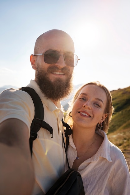 Front view smiley couple taking selfie
