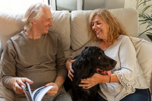 Front view smiley couple with cute dog