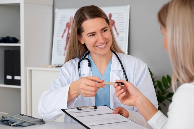 Front view smiley doctor with stethoscope