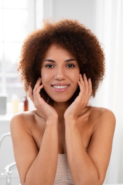 Front view smiley ethnic woman posing