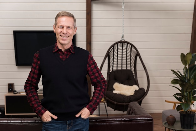 Free photo front view of smiley father posing at home