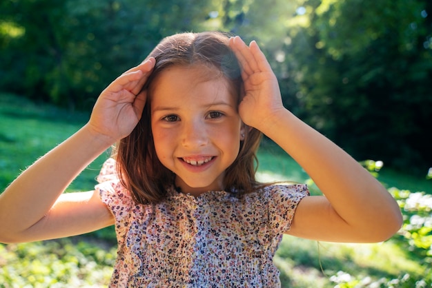 Front view smiley girl outdoors