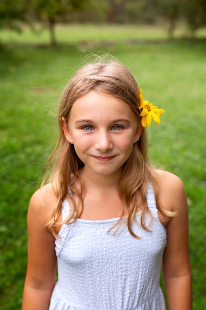 Free photo front view smiley girl outdoors