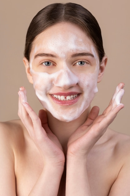 Front view smiley girl with foam mask