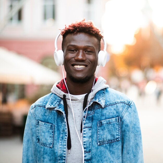 Front view smiley guy with white headphones