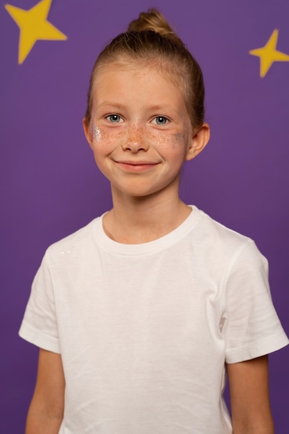 Front view smiley kid posing indoors