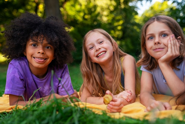 Free photo front view smiley kids outside