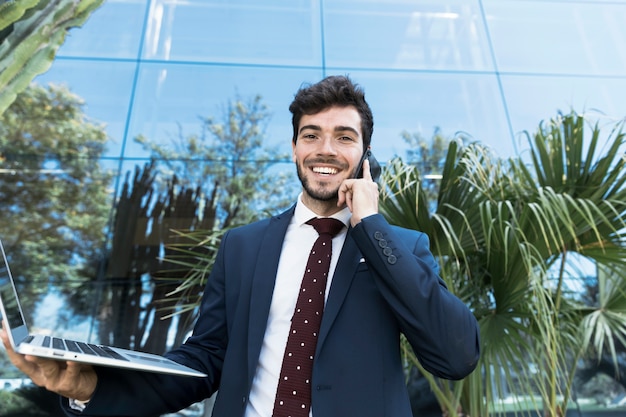 Free photo front view smiley lawyer looking at camera