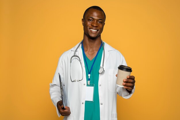 Front view smiley man holding coffee cup