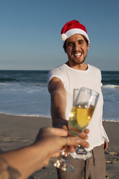 Free photo front view smiley man holding drink