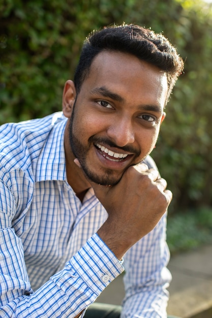 Free photo front view smiley man outdoors