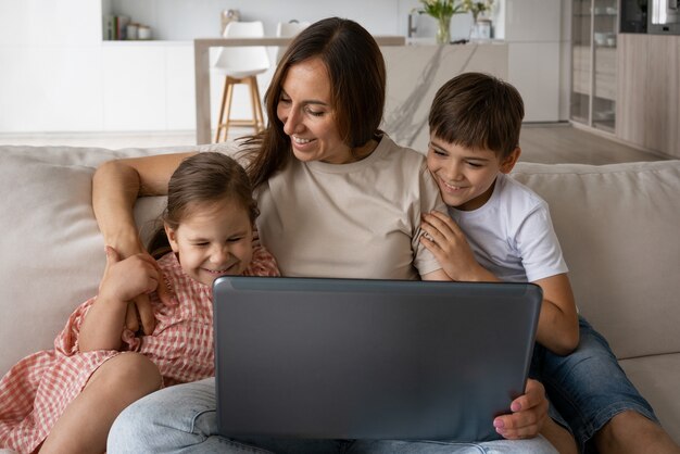 Front view smiley mother with kids