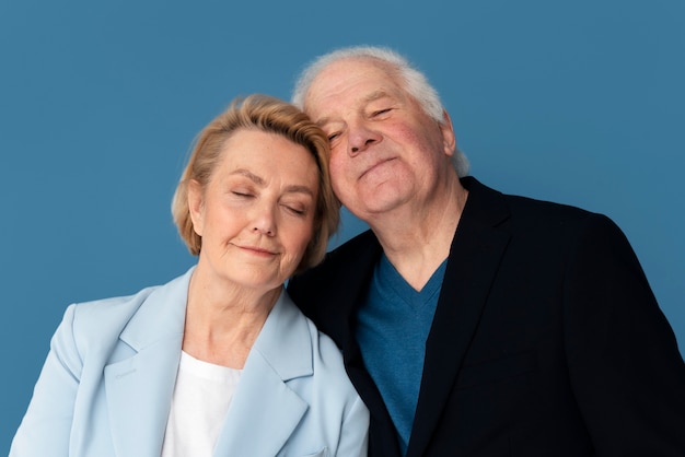 Front view smiley senior couple posing together
