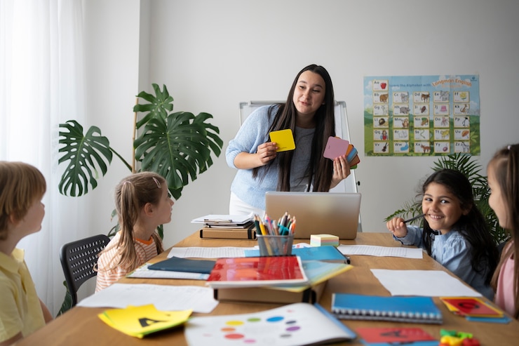 Free Photo front view smiley teacher explaining to kids