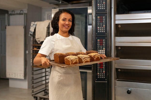 Free photo front view smiley woman baking