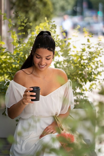 Free photo front view smiley woman in nature