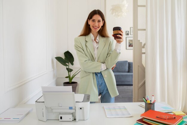 Front view smiley woman at office