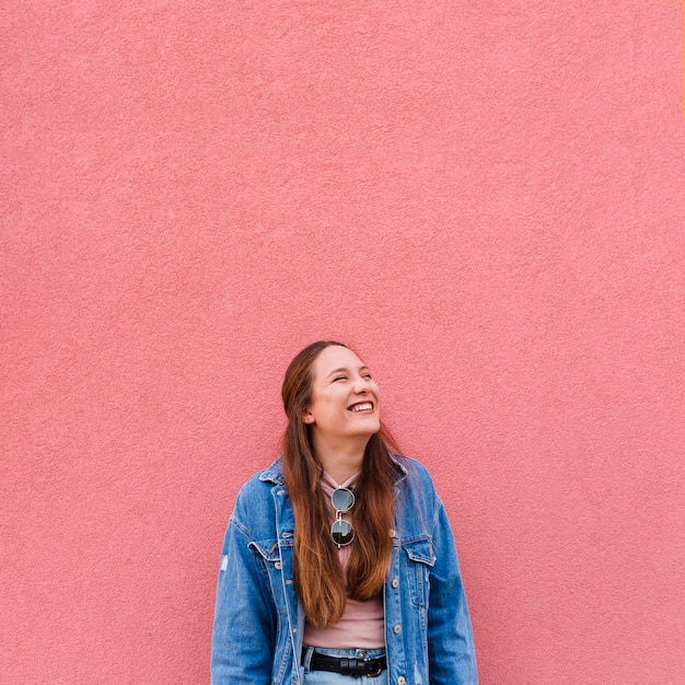 Front view of smiley woman posing with copy space