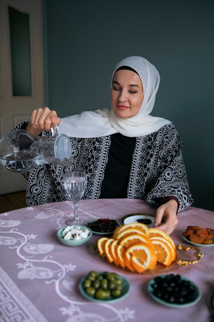 Free Photo front view smiley woman pouring water
