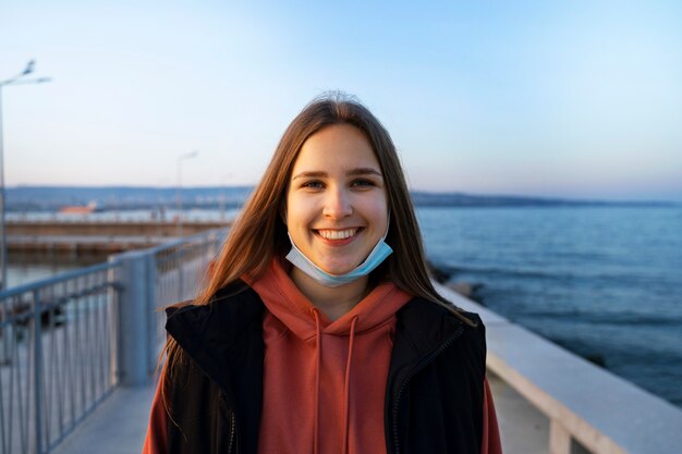 Front view smiley woman at seaside