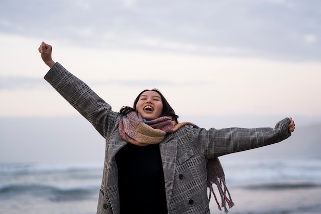 Front view smiley woman spending time in nature